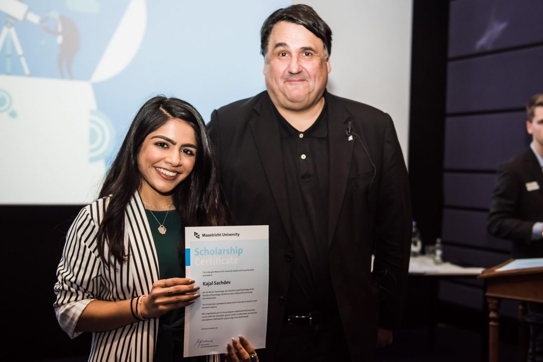 Sachdev (left) accepting her Fulbright award from the president of Maastricht University